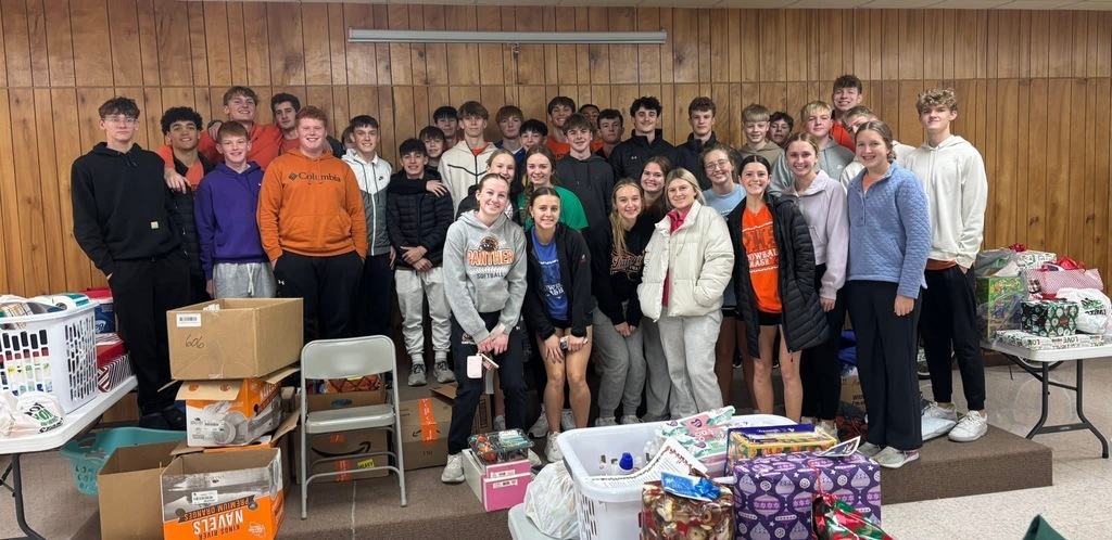 Basketball team helping with the adopt a familly program