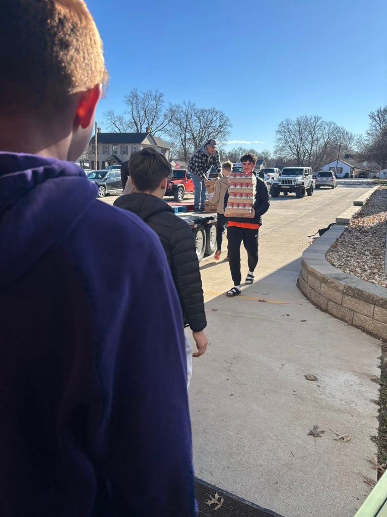 Basketball team helping with the adopt a familly program