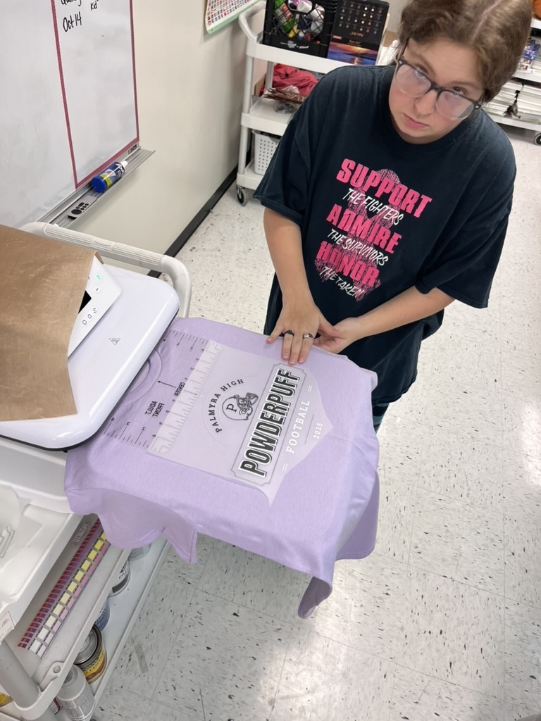 students making shirts for powderpuff homecoming rally