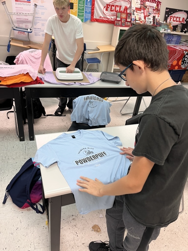 students making shirts for powderpuff homecoming rally