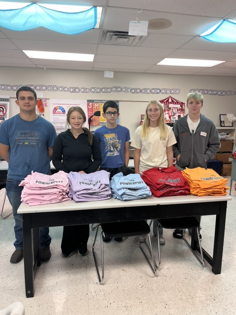 students making shirts for powderpuff homecoming rally