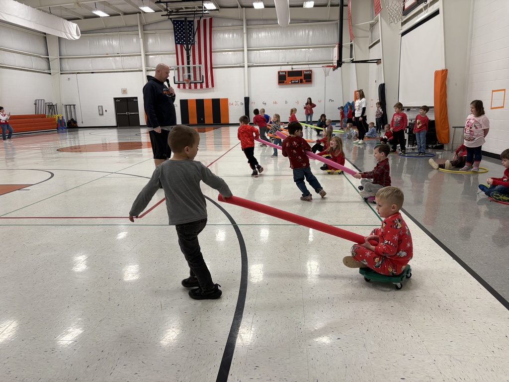 PES Students play reindeer pulling santa in gym games