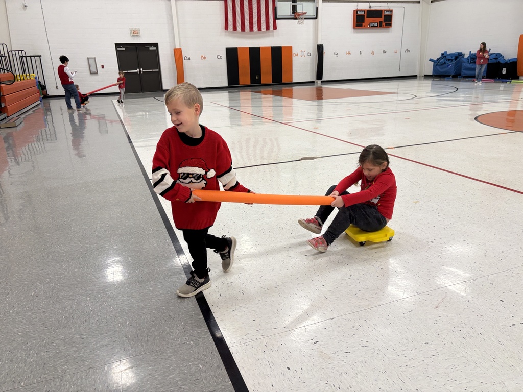 PES Students play reindeer pulling santa in gym games