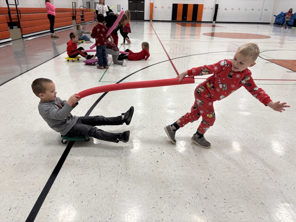 PES Students play reindeer pulling santa in gym games