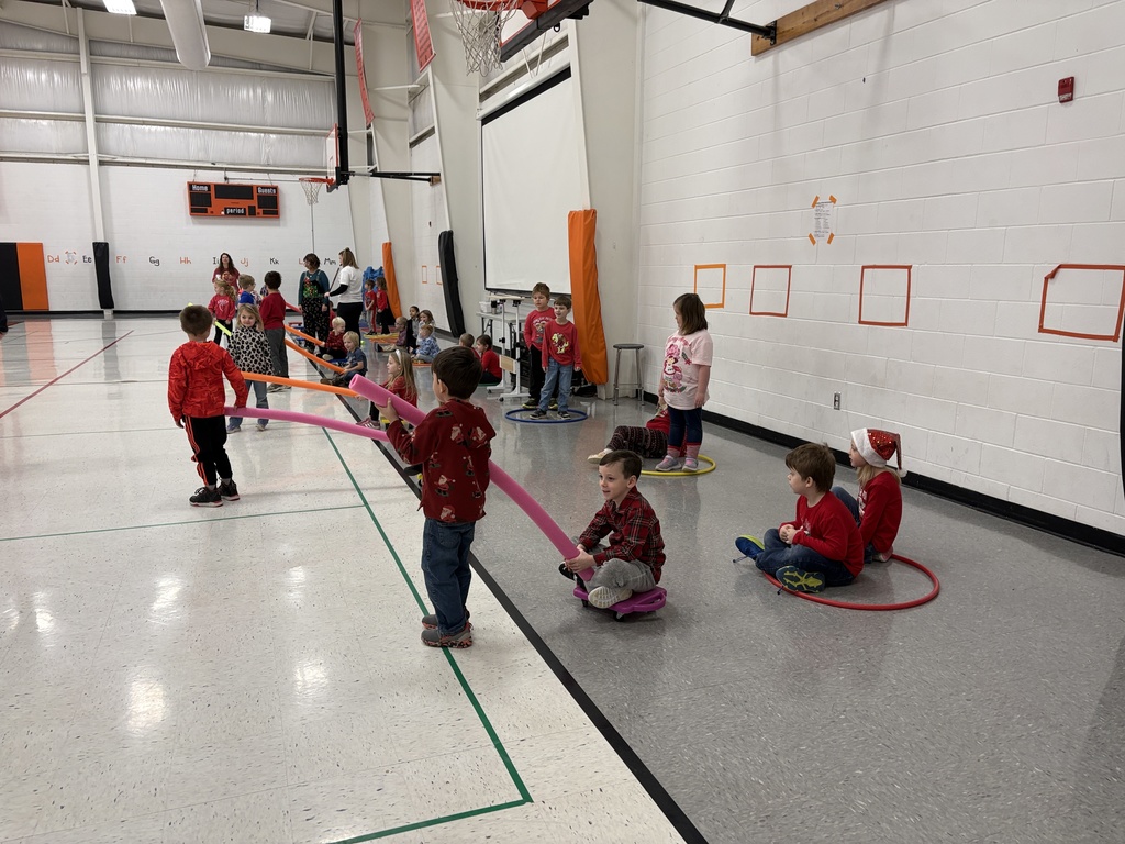 PES Students play reindeer pulling santa in gym games