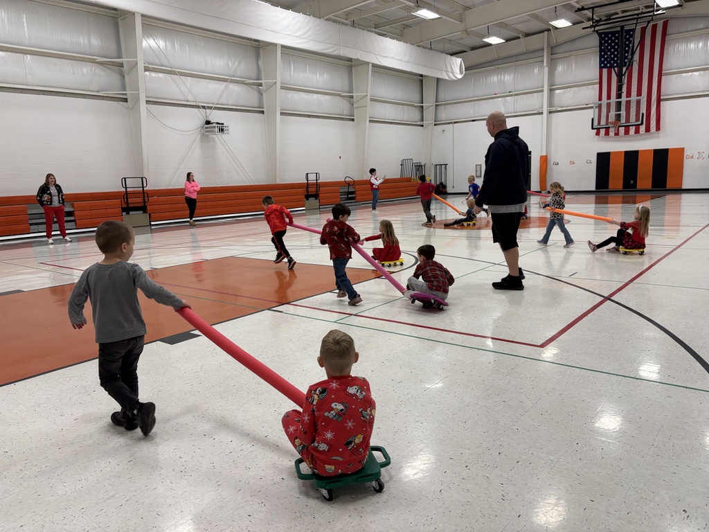 PES Students play reindeer pulling santa in gym games