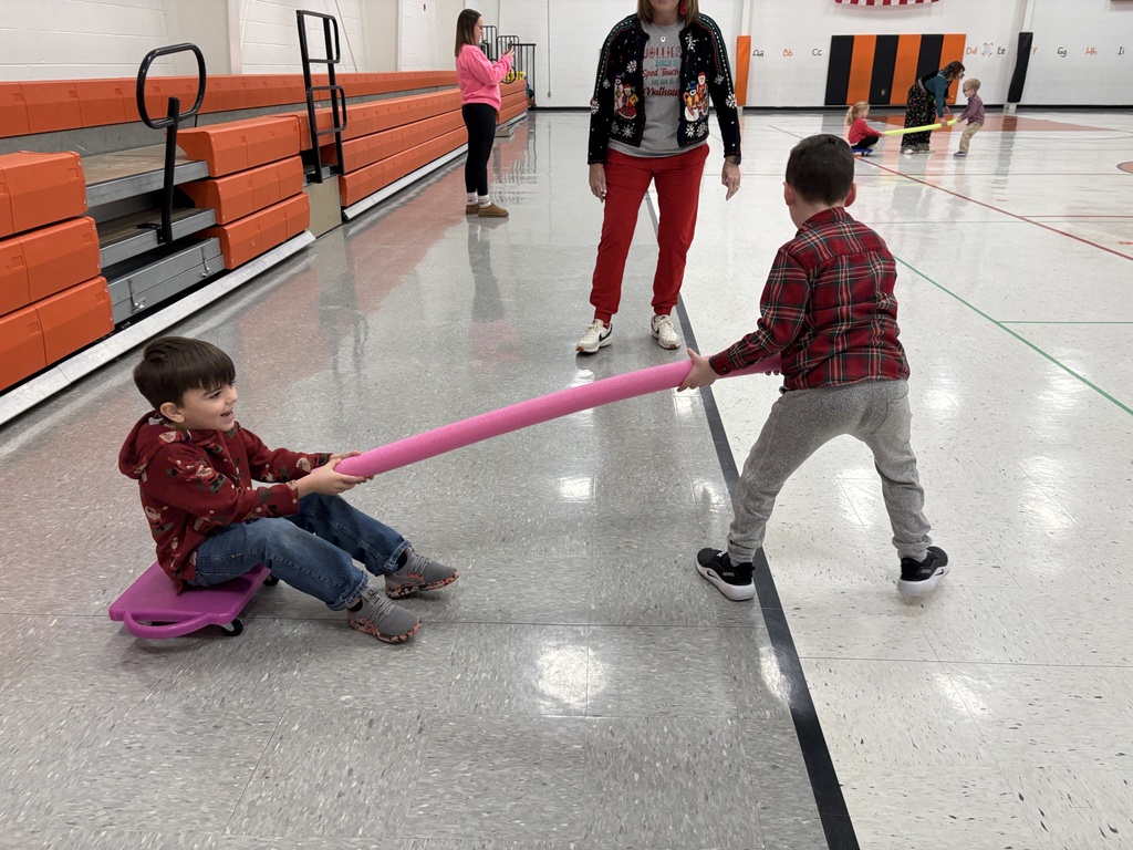 PES Students play reindeer pulling santa in gym games