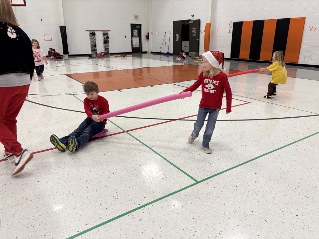PES Students play reindeer pulling santa in gym games