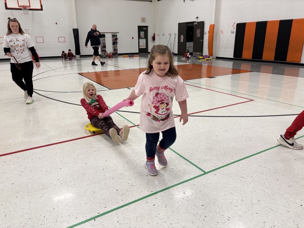 PES Students play reindeer pulling santa in gym games