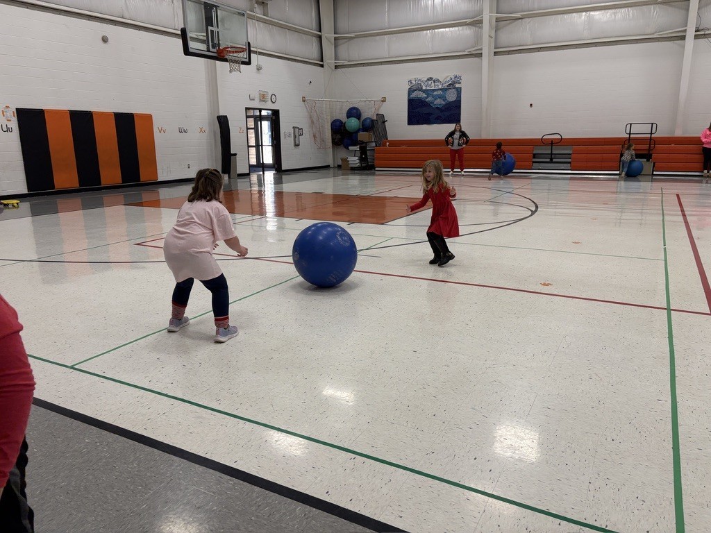 PES Students play reindeer games, rolling giant snowballs in gym
