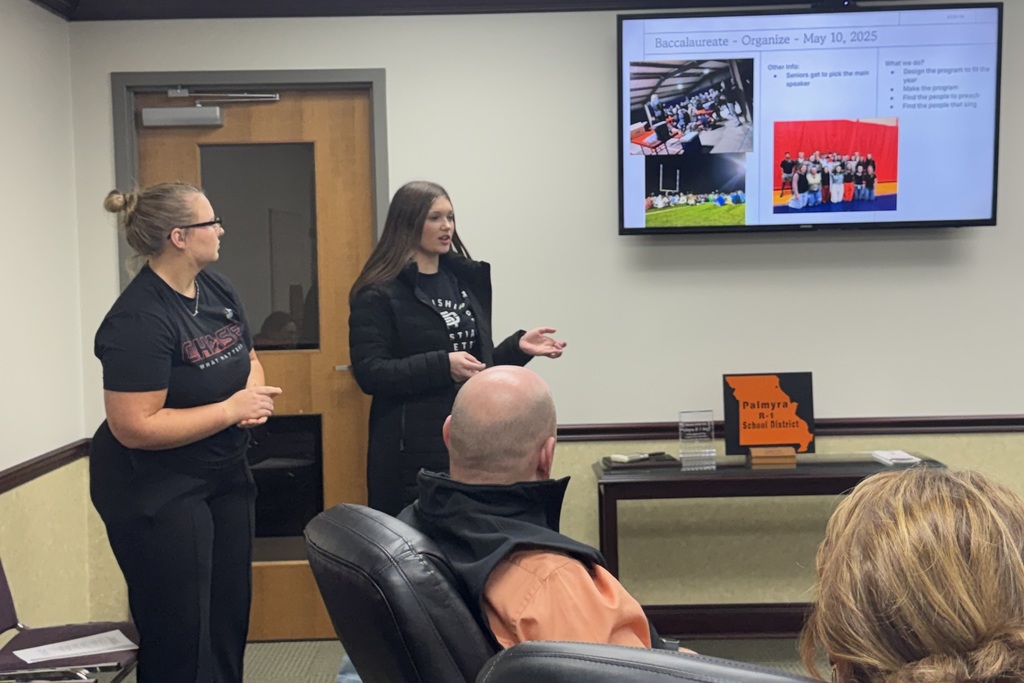 FCA sponsor and students present at board meeting