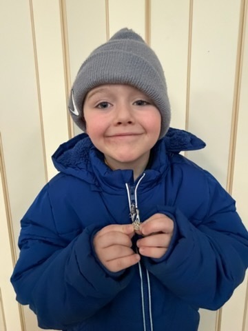 Prek student is new member of zipper club