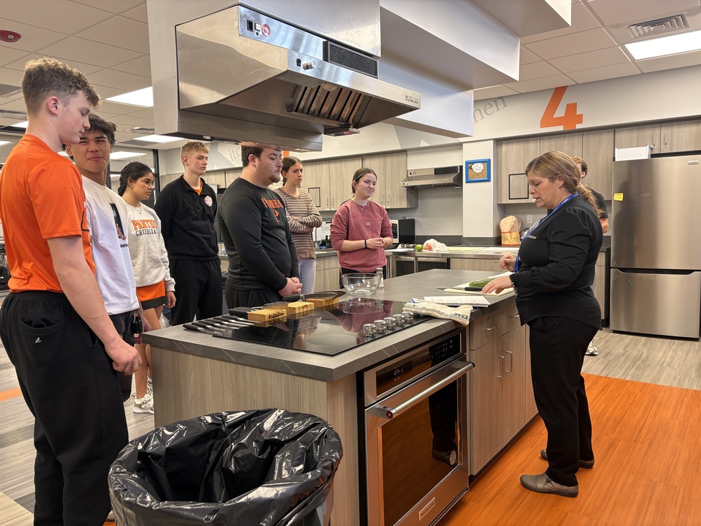 Foods class learns proper knife handling skills and make mango salsa