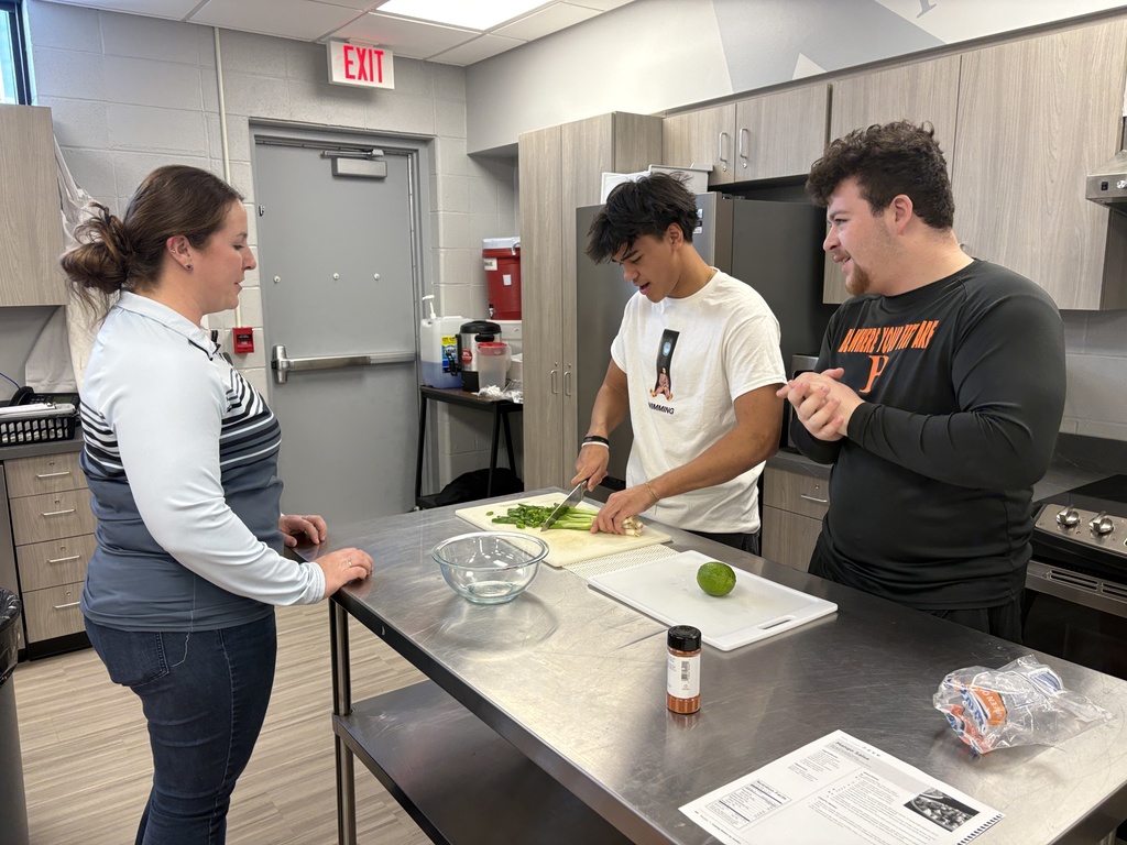Foods class learns proper knife handling skills and make mango salsa