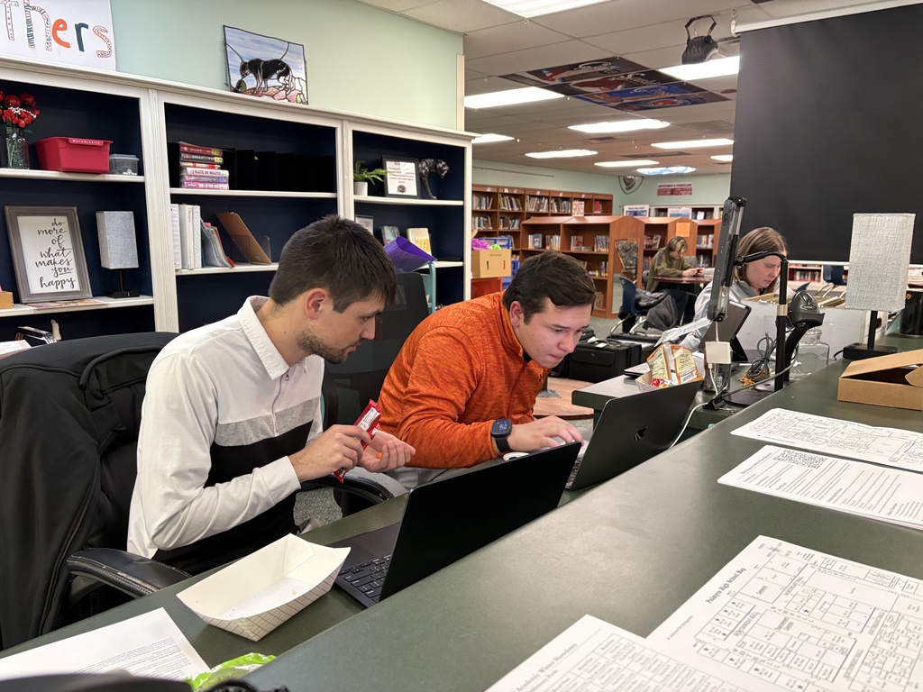 Coach Wellman works with PHS Graduate on schedule