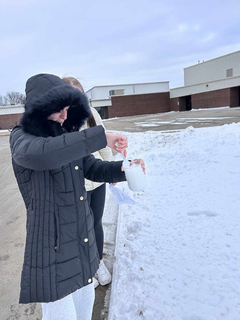 Integrated science class, student gathers snow for experiments