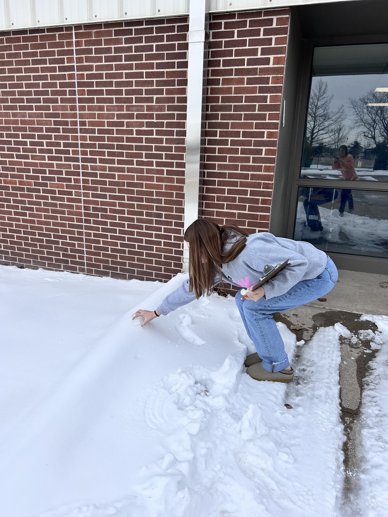 Integrated science class, student gathers snow for experiments