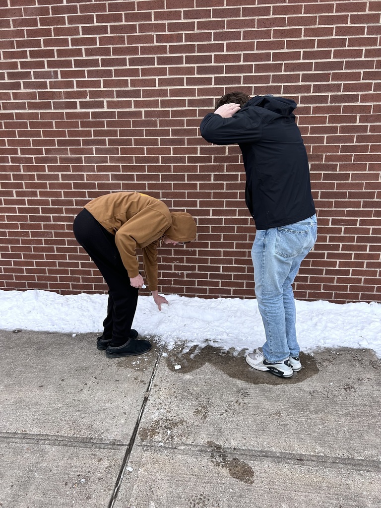 Integrated science class, student gathers snow for experiments