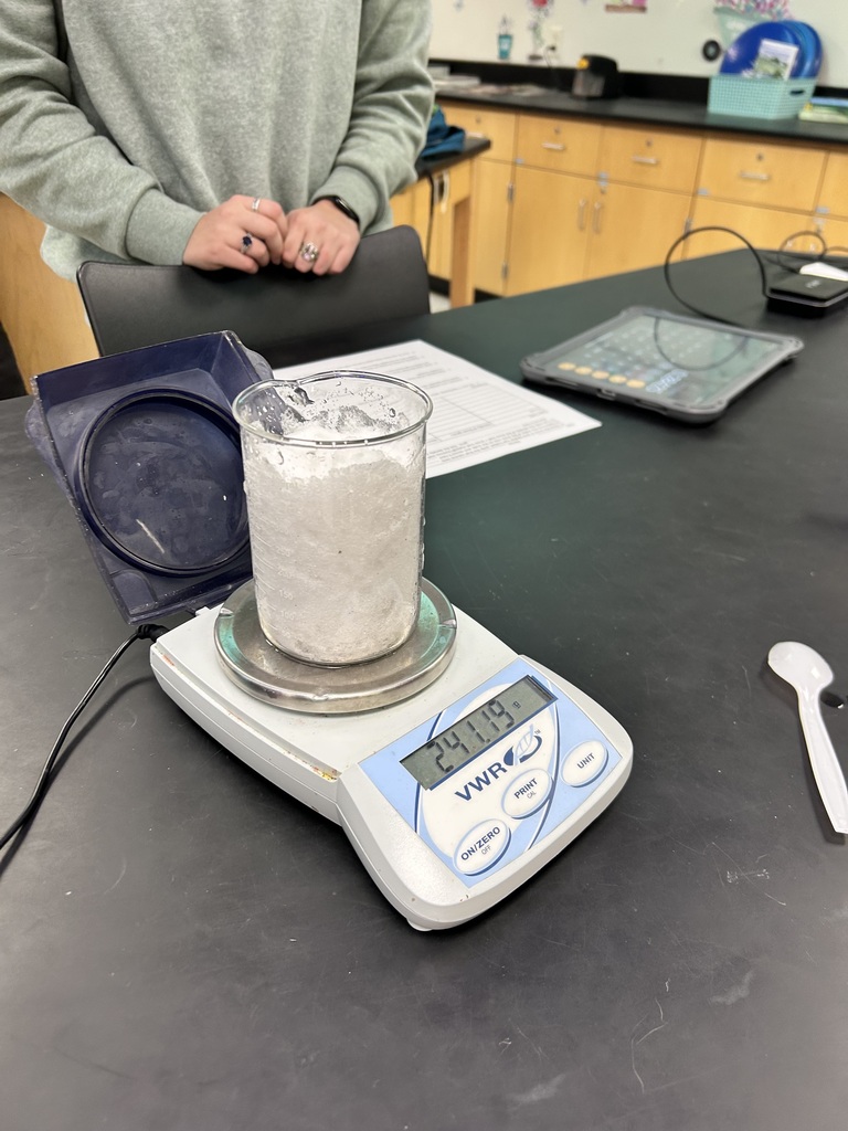 Integrated science class, student performs experiments