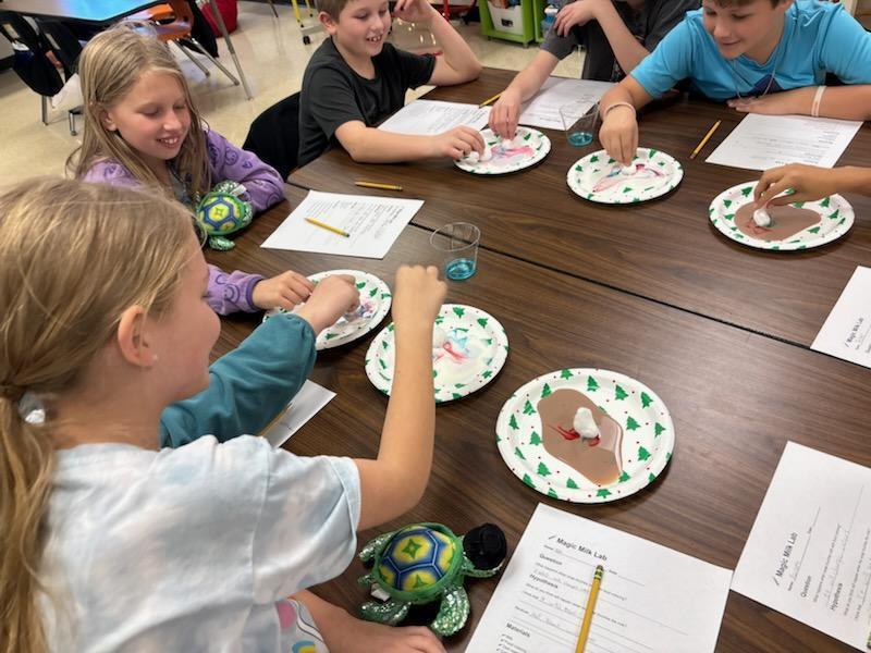 4th grade science club experimenting with milk