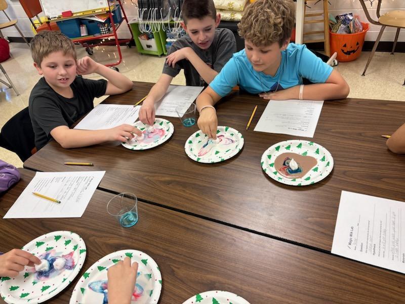 4th grade science club experimenting with milk