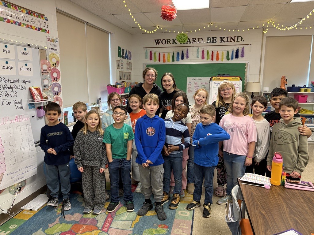 Ava and Maya with the classroom