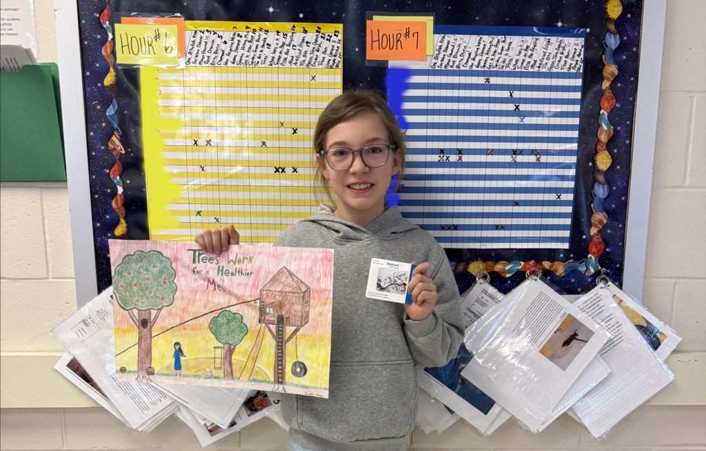 Telly with her winning poster from the arbor day contest