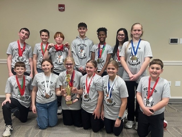 Middle School Students competing in Science Olympiad team