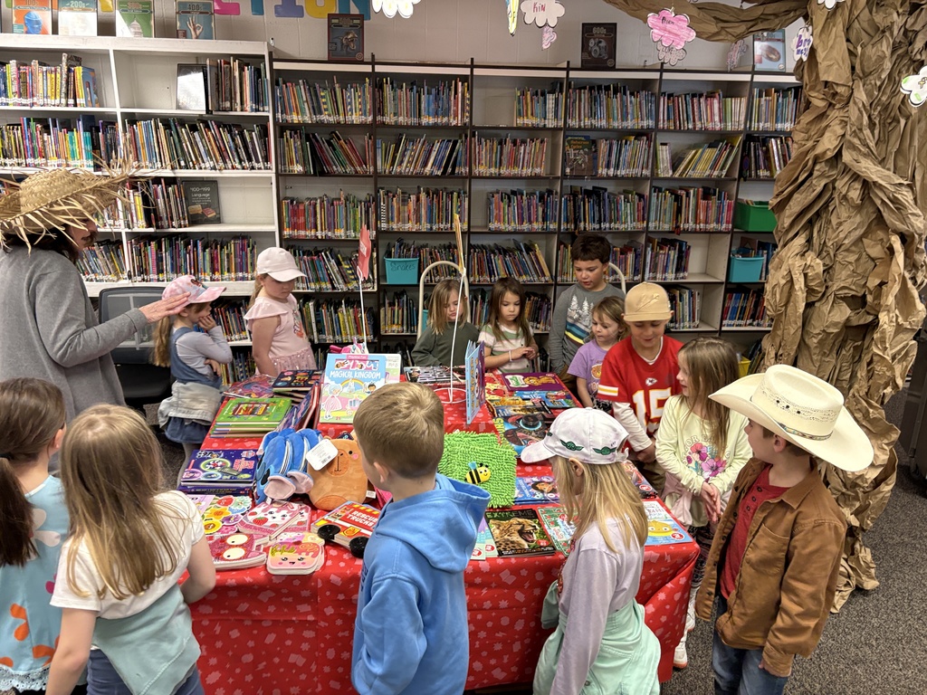 Kindergarten students viewing book fair items for sale