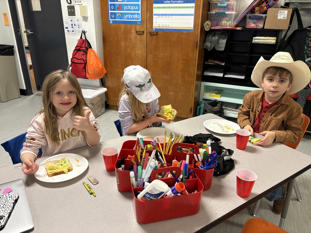 Mrs. Churchwell and kindergarten students making green eggs and ham