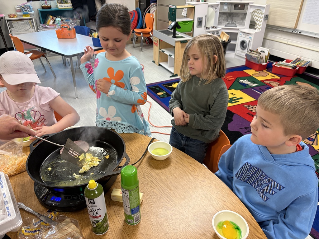 Mrs. Churchwell and kindergarten students making green eggs and ham