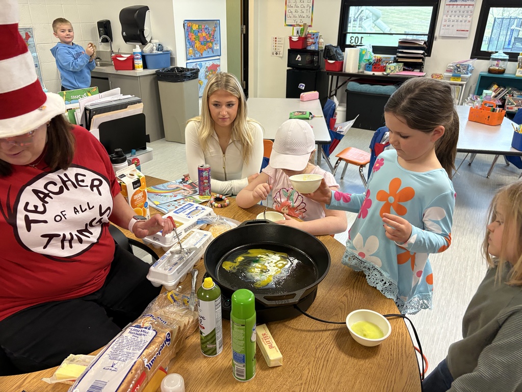 Mrs. Churchwell and kindergarten students making green eggs and ham