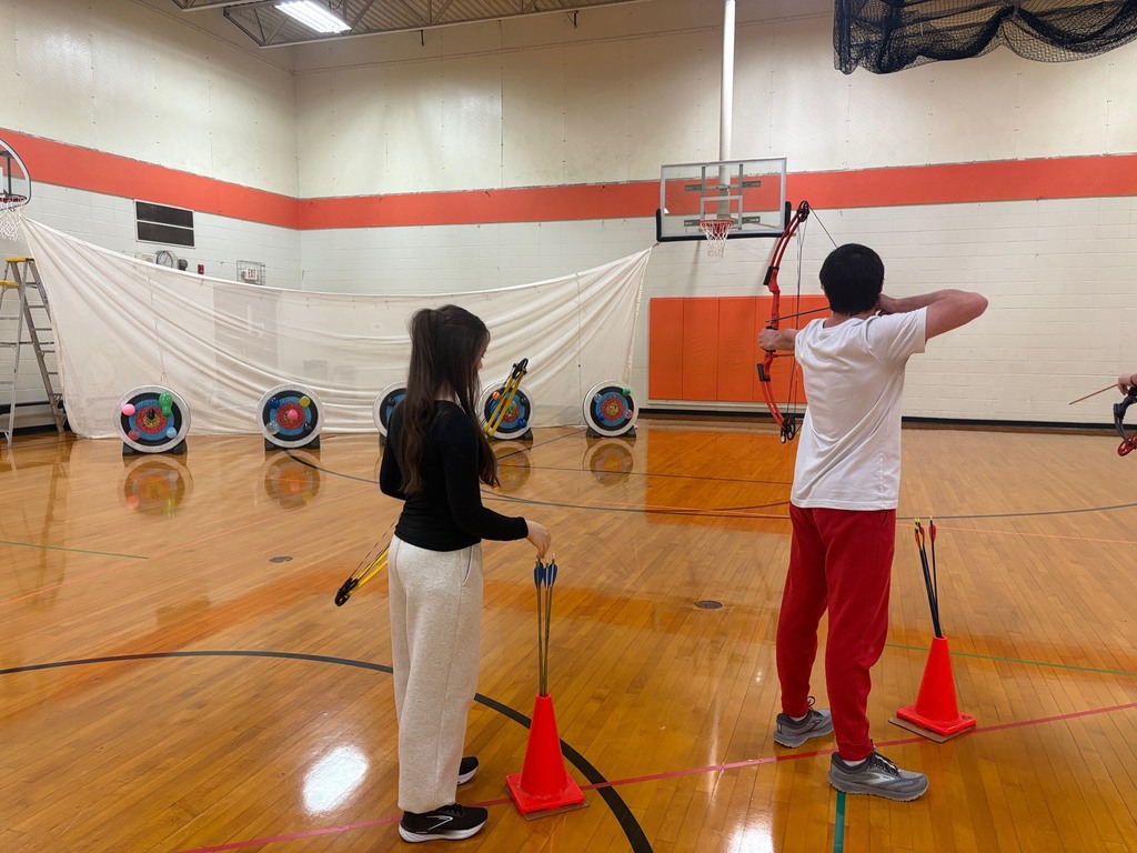 students shooting archery in Integrated Science