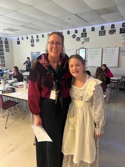 Staff member and Student dressed for Ellis Island simulation
