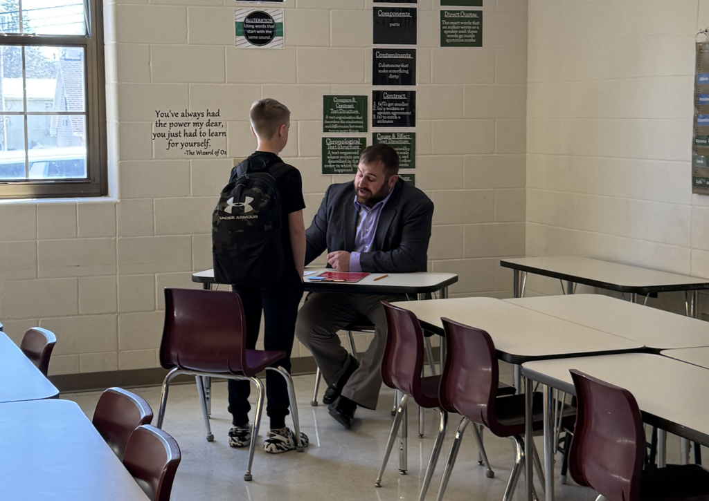 student meets with Community member in Ellis Island simulation
