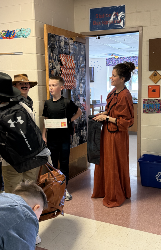 Students line up outside classroom in Ellis Island simulation