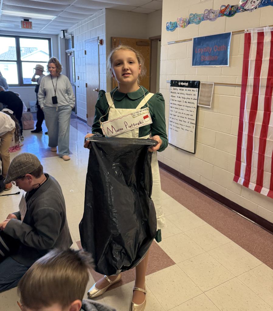 Students line up outside classroom in Ellis Island simulation