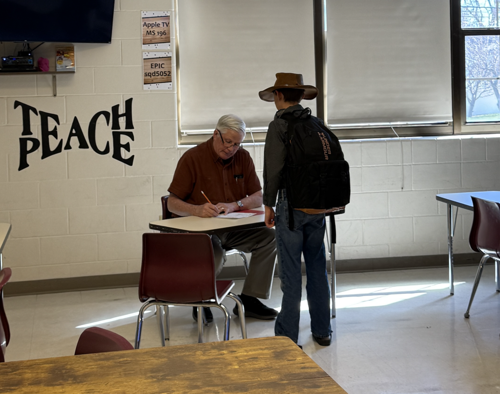 student meets with Community member in Ellis Island simulation