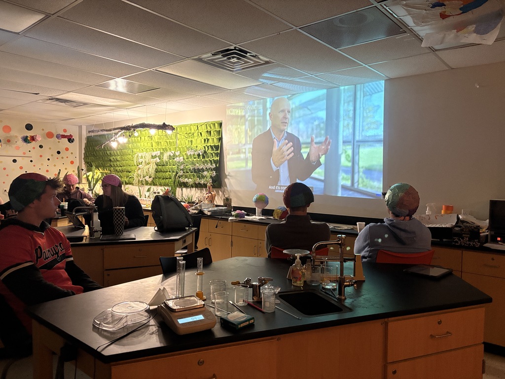 students in science class watch video about brains