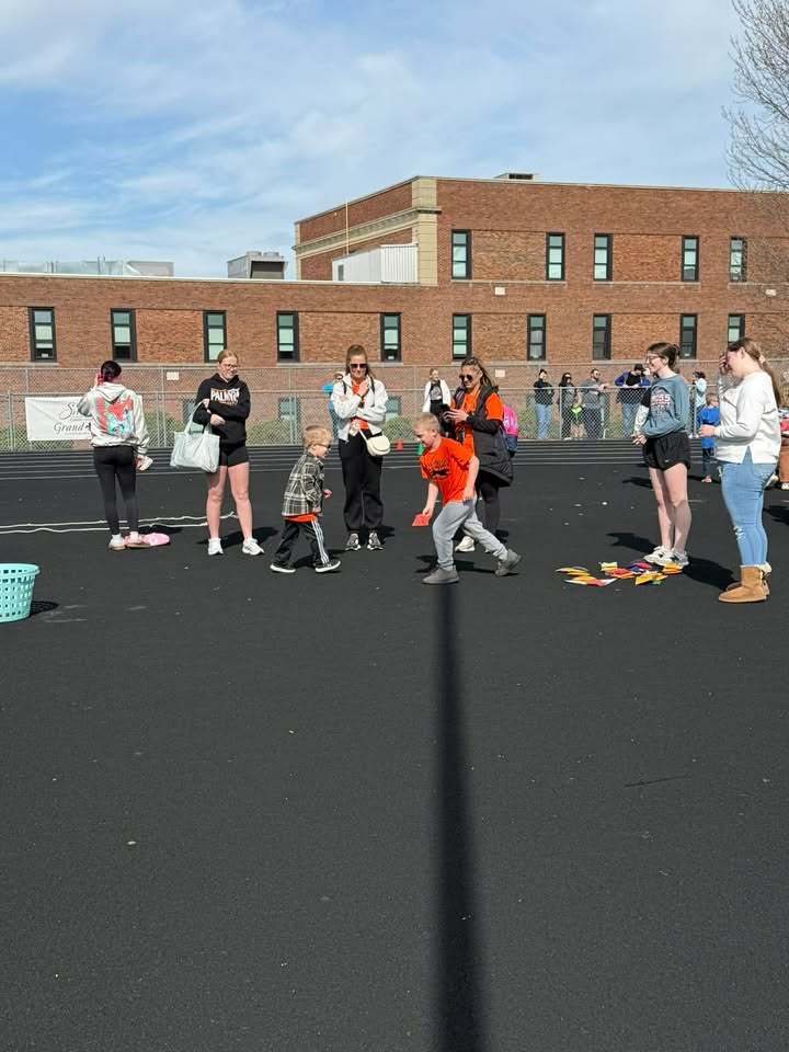 Students compete at Special Olympics with staff and buddies watching