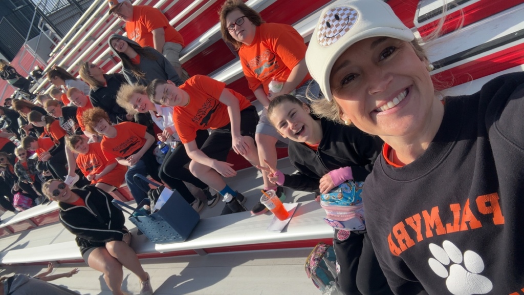 student at Special Olympics with their teacher