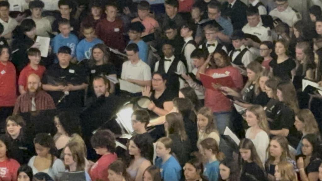Mrs. Gingerich performs with Palmyra Middle School Honors Choir Students at NEMMEA Honors Choir performance in Columbia MO