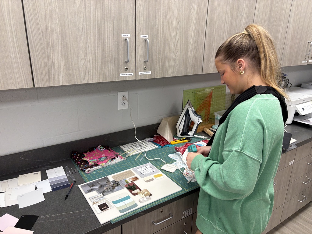 Interior design class using samples to design their model air bnbs