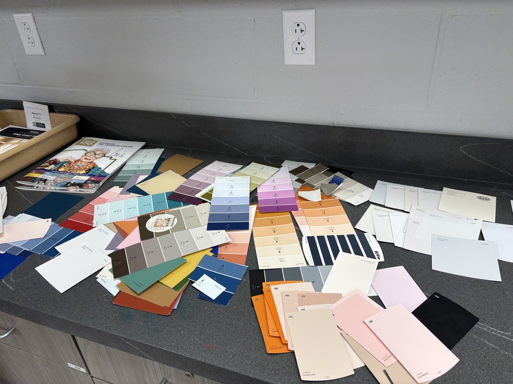 Interior design class using samples to design their model air bnbs