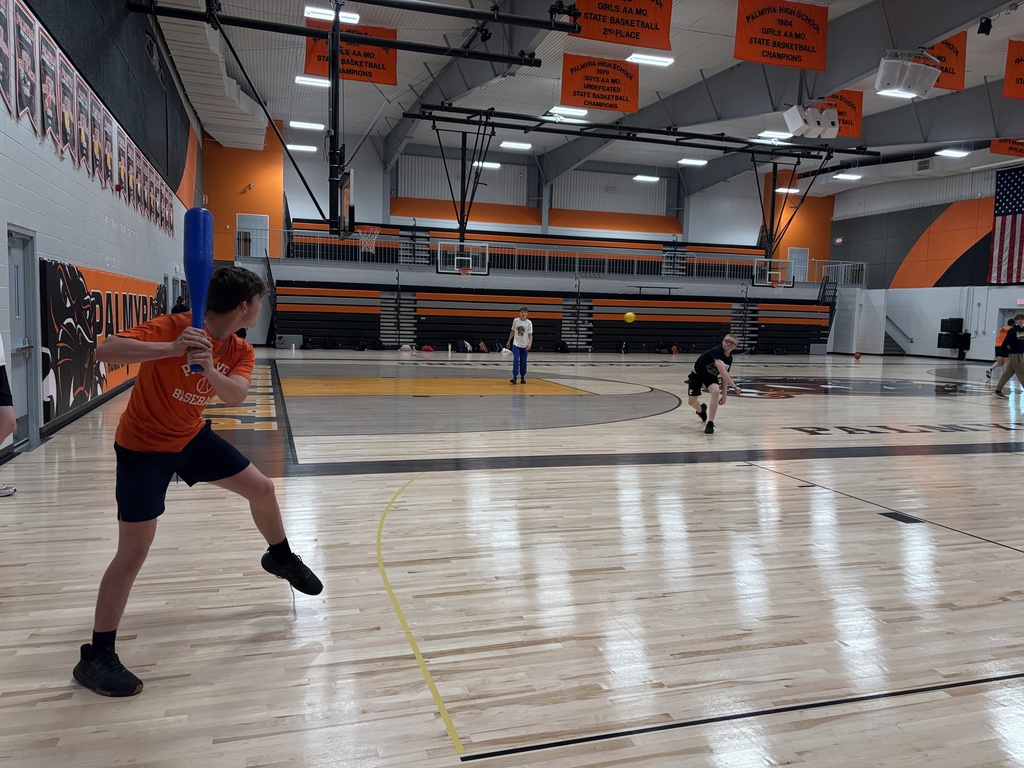 Fitness class playing wiffle ball