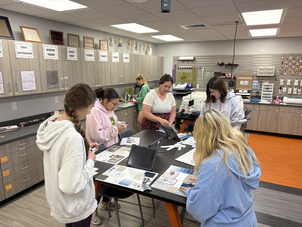 Interior design class using samples to design their model air bnbs
