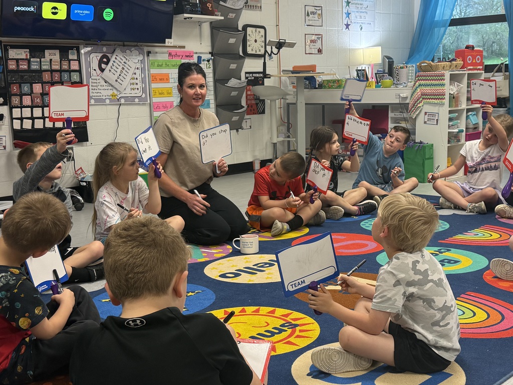 Mrs. Barnes working with her classroom of students on an activity