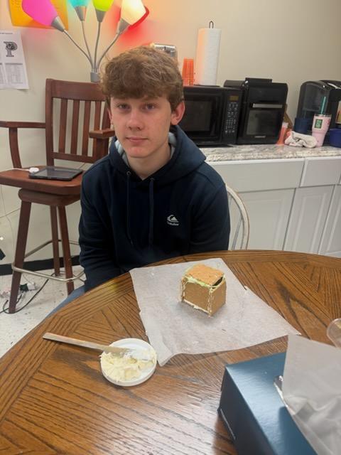 students create peep houses from graham crackers and icing in mythology class