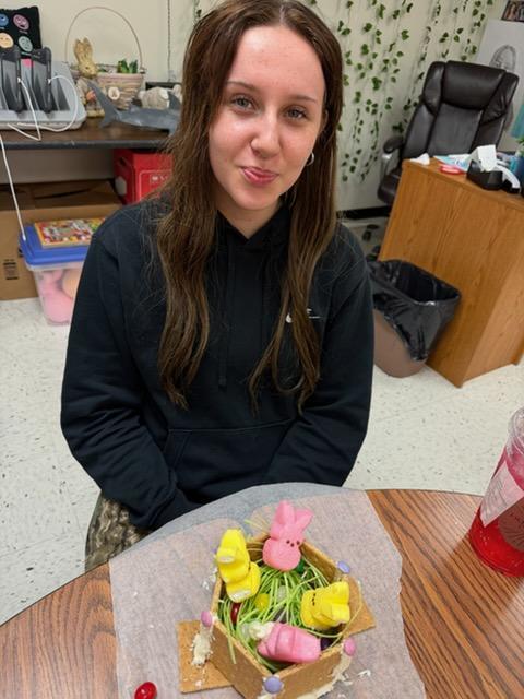 students create peep houses from graham crackers and icing in mythology class