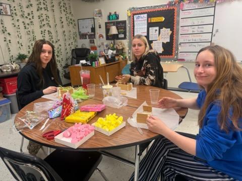 students create peep houses from graham crackers and icing in mythology class